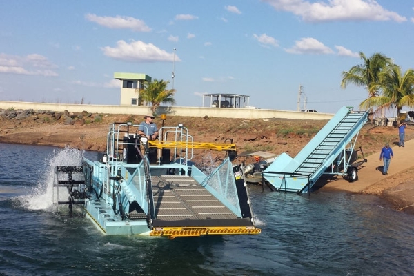 Mechanical Weed Harvester in Brazil Weed harvester with offloading conveyor on the shore in Brazil