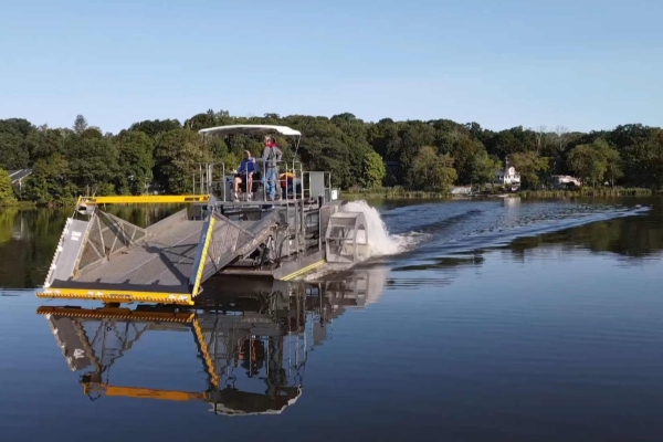 Musconetcong Port 2 Stainless steek aquatic weed harvester barely makes a wake in New Jersey.